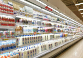 Abstract,Blur,Supermarket,Grocery,Store,Refrigerator,Shelves,With,Fresh,Milk