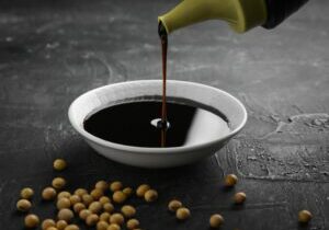 Pouring,Sweet,Soy,Sauce,Into,White,Ceramic,Bowl,From,Bottle